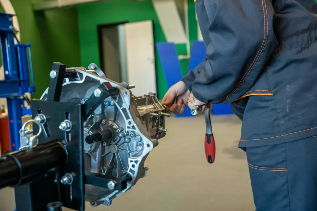 Drivetrain & differential repair — transmission being serviced in a workshop