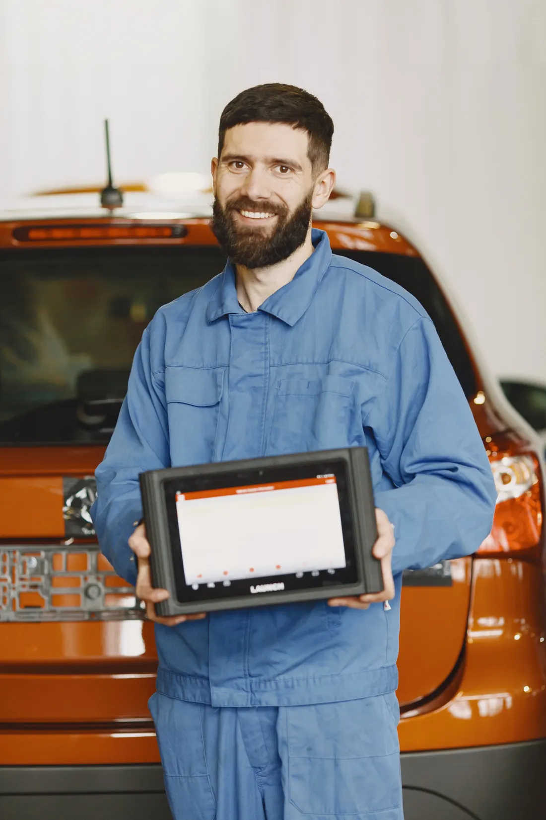 Auto diagnostics — technician using an automotive diagnostic scan tool