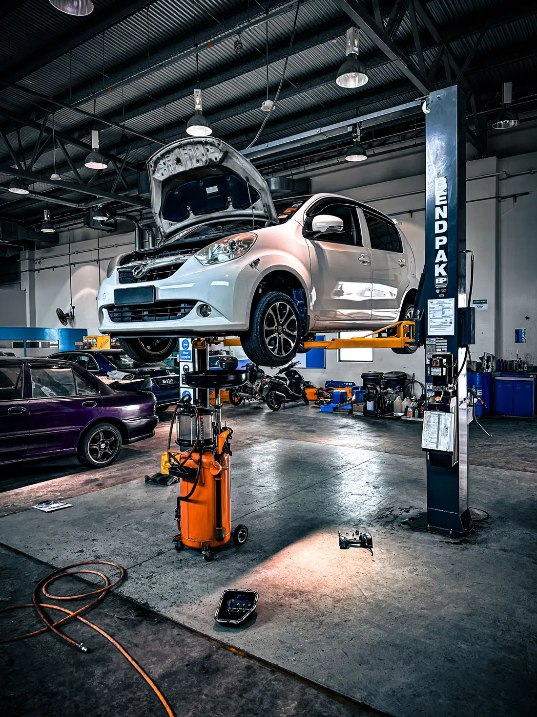Fleet & truck services — vehicle on a lift in a modern auto repair shop
